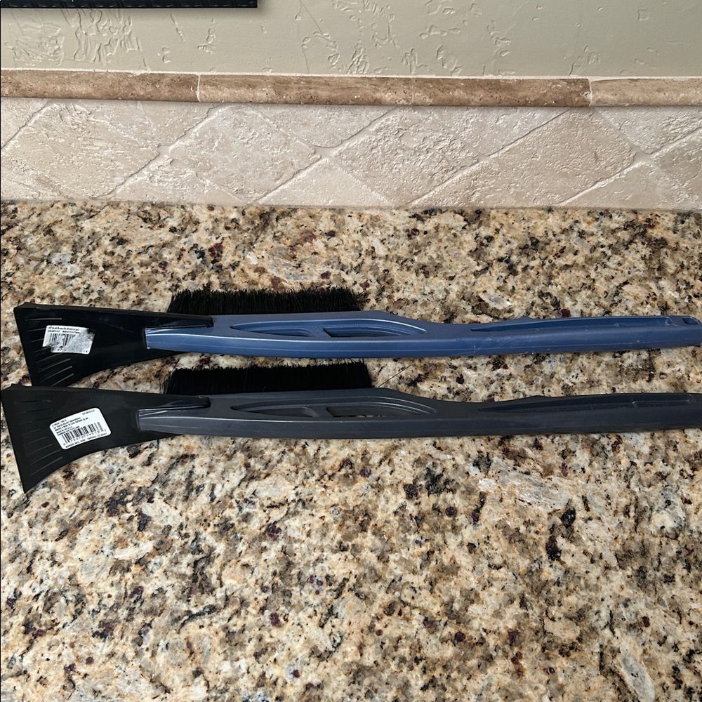 Two Black and Blue Car Snow Brushes